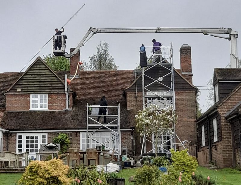 The Roof Moss Cleaners using cherry picker and scaffolding to clean roof safely and professionally in Kennington, Oxfordshire