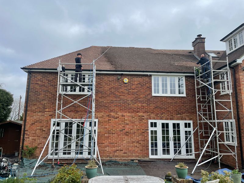 Roof cleaning carried out safely from scaffold towers by The Roof Moss Cleaners in Kennington